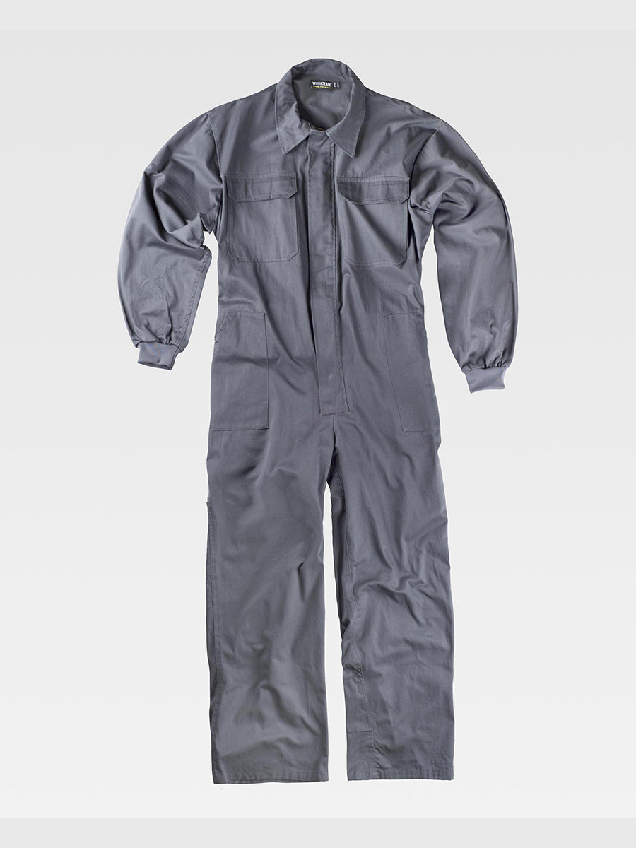 One-piece jumpsuit with concealed zipper with Velcro flap. Shirt collar, elastic cuffs Two chest pockets with flap and Velcro closure Two side pockets, one back pocket, one tool pocket Elastic on the back waistband.