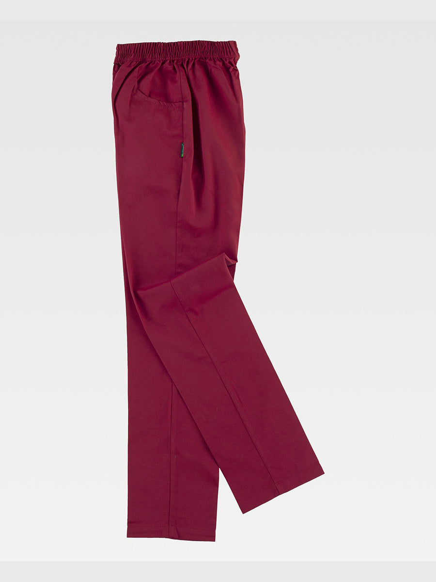 Unisex trousers with straight hem and elastic waistband, without flap. Two side pockets with rounded opening