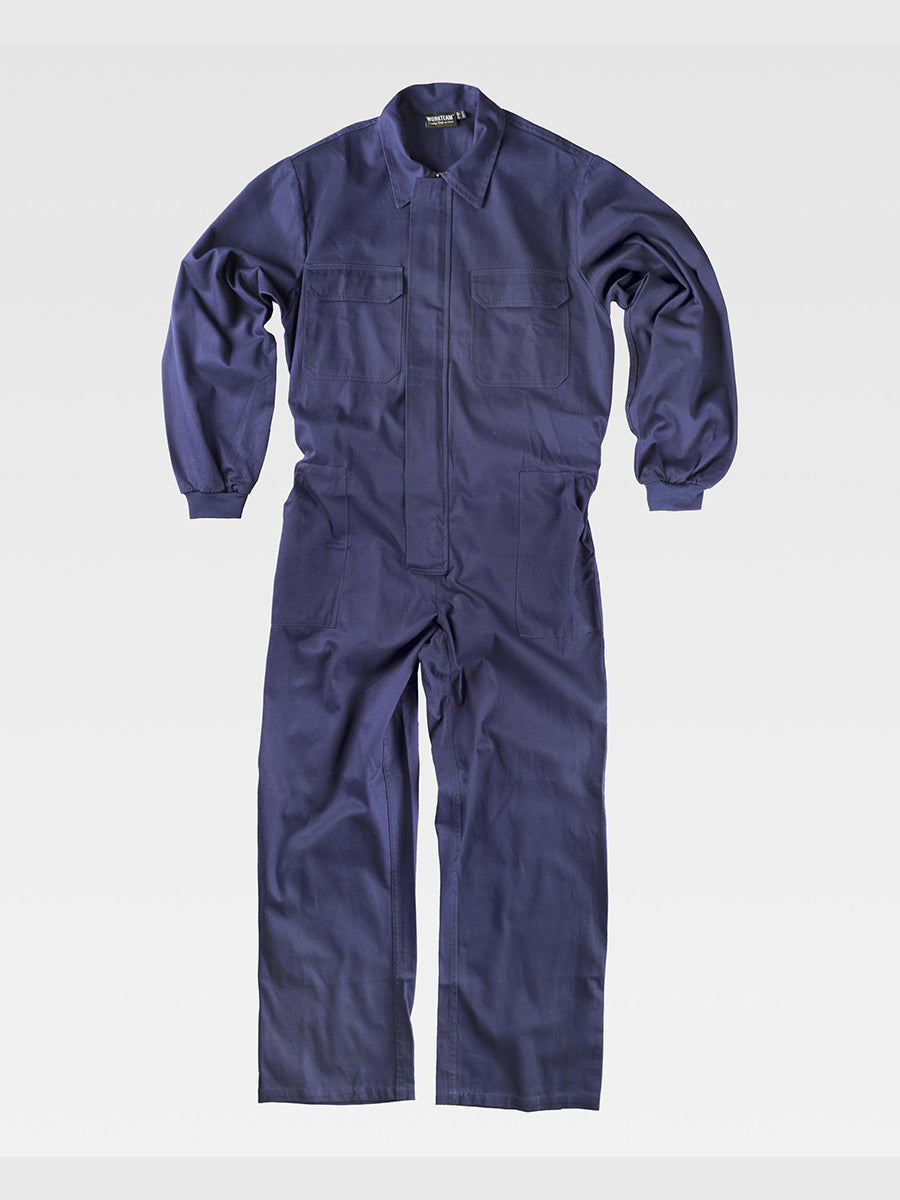 One-piece jumpsuit with concealed zipper with Velcro flap. Shirt collar, elastic cuffs Two chest pockets with flap and Velcro closure Two side pockets, one back pocket, one tool pocket Elastic on the back waistband.
