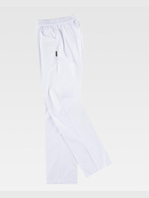 Unisex trousers with straight hem and elastic waistband, without flap. Two side pockets with rounded opening